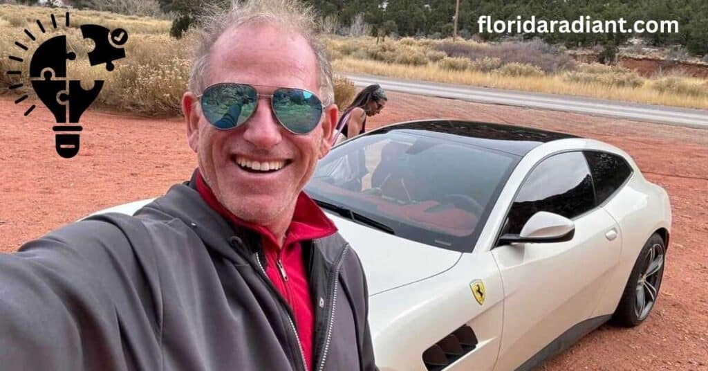 A man poses for a selfie with his car, showcasing his enthusiasm and connection to his vehicle.