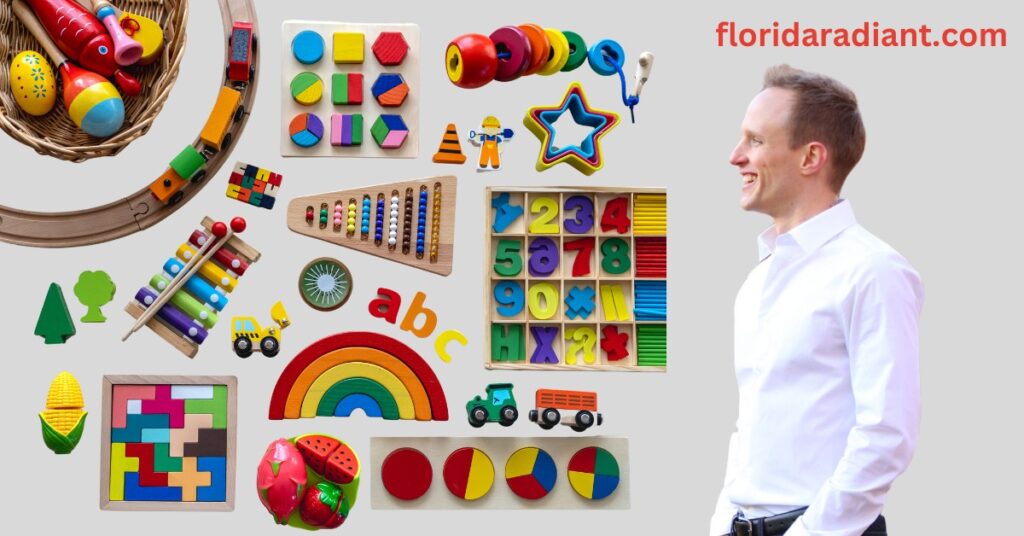 A man dressed in a white shirt and tie poses in front of a diverse collection of toys, highlighting a cheerful setting.