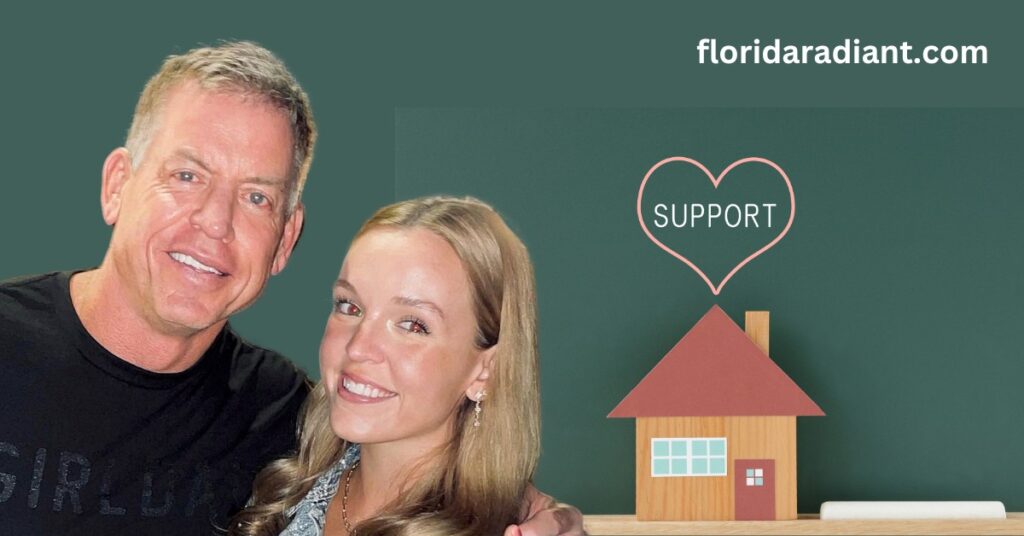 A couple stands in front of a house featuring a heart design, symbolizing their affection and connection.